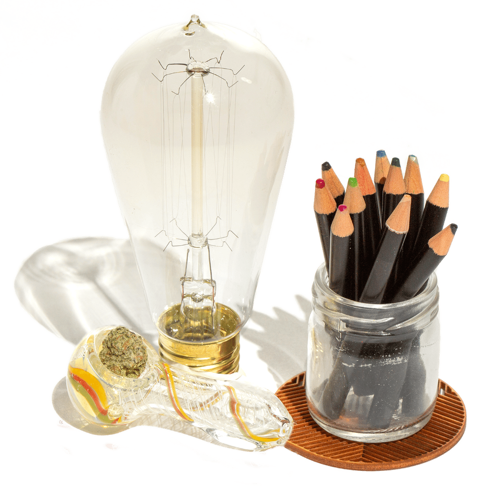 Edison Lightblub, glass pipe with cannabis flower and colored pencils in glass jar